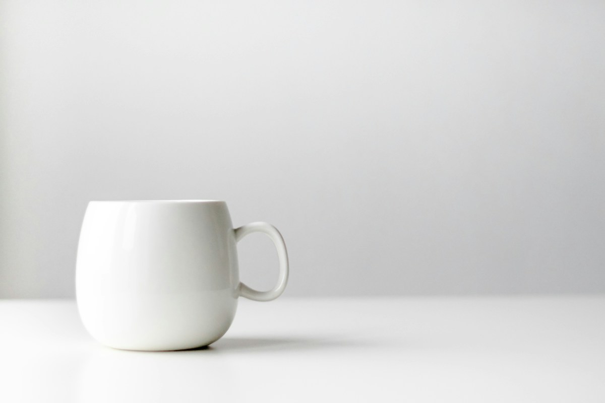 Sample stock photo of a plain white ceramic mug
